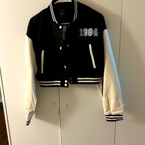 Forever 21 Black and White Varsity Jacket with Ribbed Trim.  1984 logo
